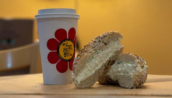 Moe's Broadway Bagel with homemade cream cheese and a cup of fresh brewed Moe Joe coffee