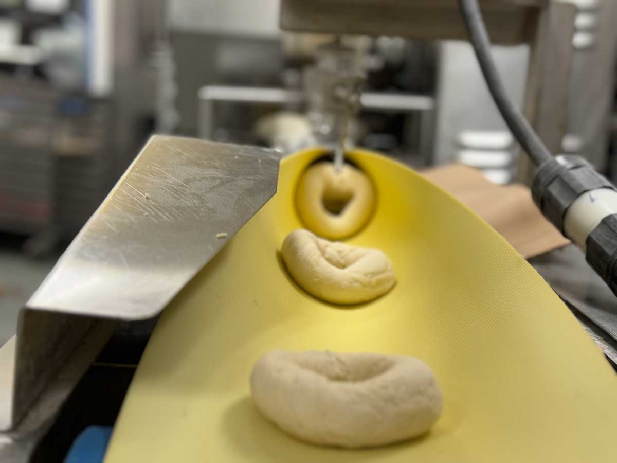 Moe's Broadway Bagel dough is rolled and shaped